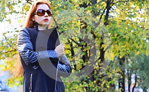 Girl autumn leaves coat sunglasses