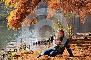 Girl at autumn park - orange colors