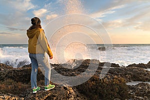 Girl in autumn by the sea