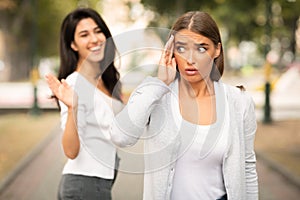 Girl Avoiding Meeting Friend Pretending Not Noticing Her Walking Outdoors
