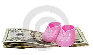 Girl Baby Booties Sitting on a Stack of Money With Shadows
