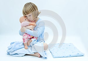 Girl and baby doll