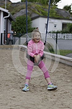 Girl in a baby swing
