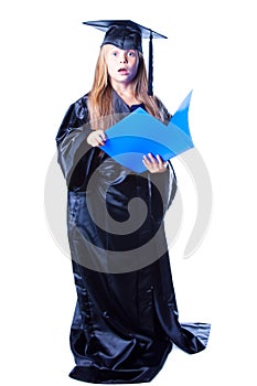 Girl with bachelor hat and graduation gown photo