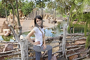 Girl on the background of animals and nature of biopark in Valencia photo