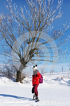 Girl on a background of a winter landscape.