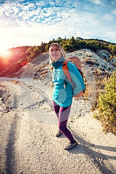 A girl with a backpack.