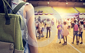 Girl with backpack attend school activities.