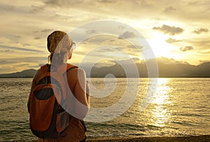 Girl with a backpack dreams of travel