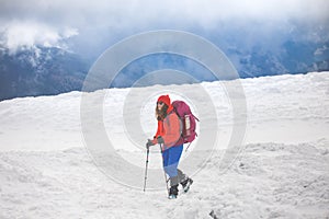 The girl with the backpack is on the ice.