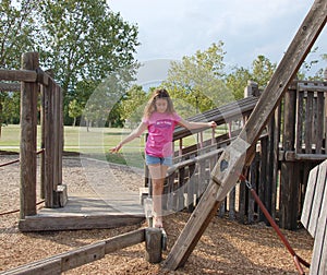 Girl on balance beam