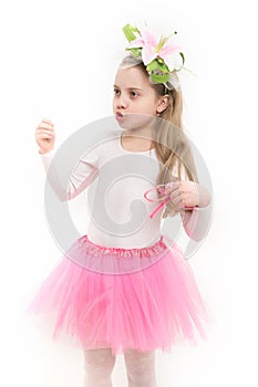 Girl ballerina with flower in long blond hair talk