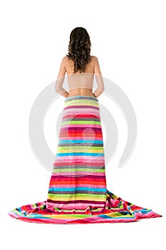 Girl bare back standing wrapped with towel