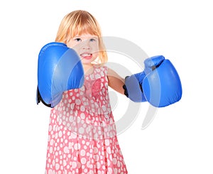 Girl with bared teeth and boxers gloves