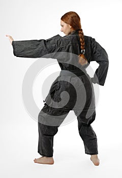 Girl barefooted in combat stance, rear view
