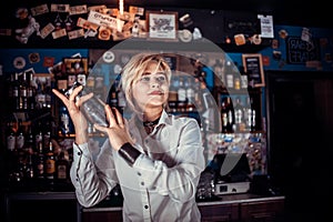 Girl bartender makes a cocktail in the brasserie photo