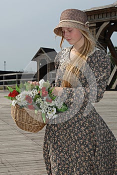 Girl with basket of flowers