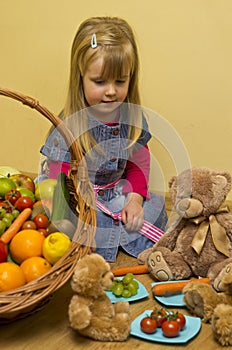 Girl with basket of fruit and vegetables