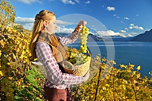 Girl with a basket full of grapes