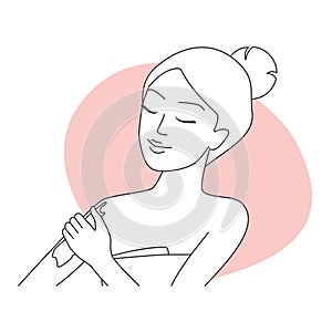 Girl in bath towel applying cream to skin of forearm to moisturize, line icon photo