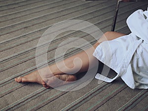 Girl in a bathrobe lying on the bed