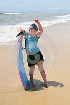 Girl on the Beach Boogie Boarding