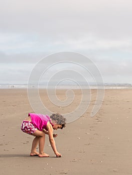 Girl beach combing