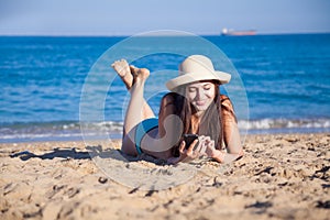 Girl on the beach sea talking on phone