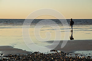 A girl at the beach shore photo