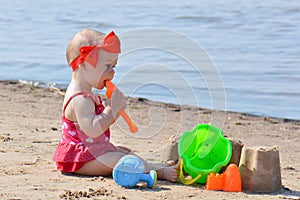 Girl with beach toys