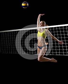 Girl beach volleyball player ver with ball and net
