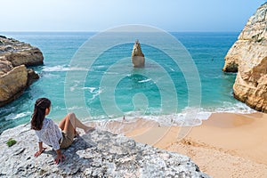 Girl at beautiful beach Carvalho of Algarve, Portugal photo