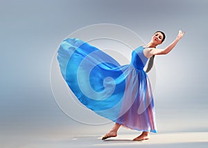 girl beautiful dress is engaged in dancing in the studio