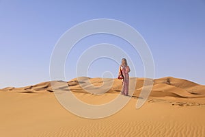 A girl in a beautiful Moroccan dress. Merzouga Morocco