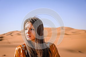 A girl in a beautiful Moroccan dress. Merzouga Morocco