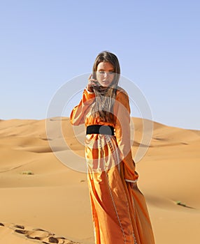 A girl in a beautiful Moroccan dress. Merzouga Morocco