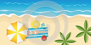 Girl on beautiful palm beach under umbrella with sunglasses and swim ring