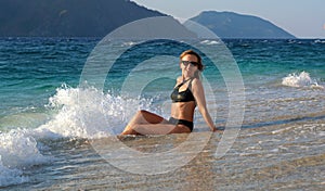 Girl in a beautiful swimsuit on a Turkish beach