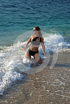 Girl in a beautiful swimsuit on a Turkish beach