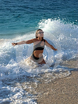 Girl in a beautiful swimsuit on a Turkish beach