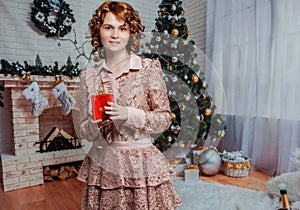 Girl in beautiful vintage dress at Christmas