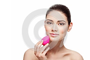 Girl with beauty blender sponge