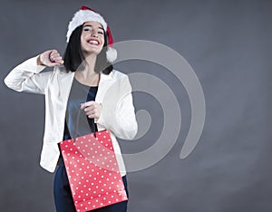 Girl beauty with braces a cap santa gift bag