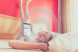 Girl on bed with ipad