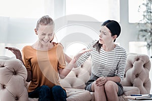 A girl being hysterical at psychologists office photo