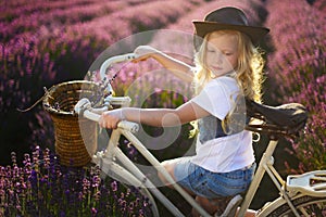 Girl on bicicle lavender photo