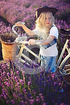 Girl on bicicle lavender photo