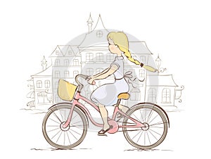 Girl on a bicycle in a European city