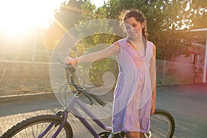 Girl in a bicycle outdoors