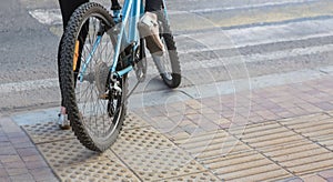 Girl on bicycle at pedestrian crossing